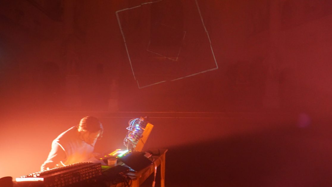 Musician Julius Holtz red light and haze