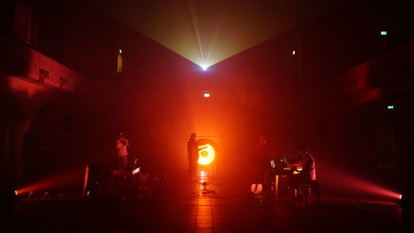 red light haze with musicians in the background
