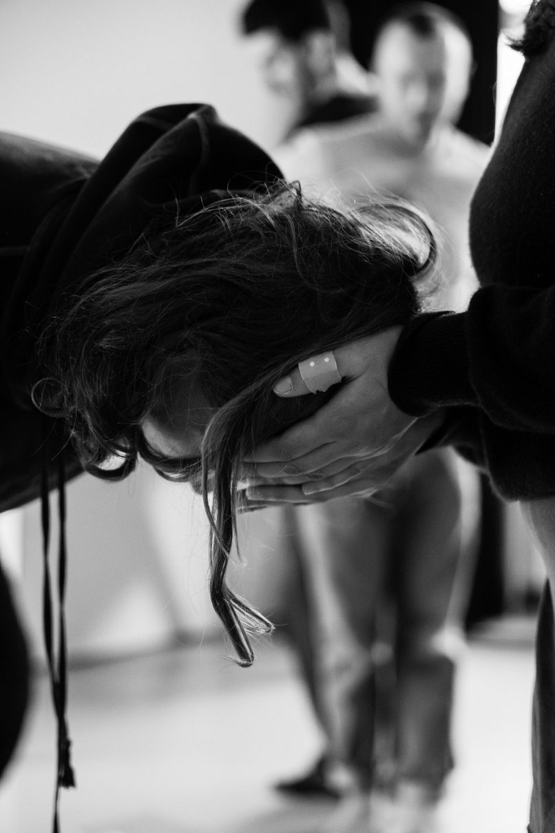 A head resting in another's hands a detail of somatic movement practice